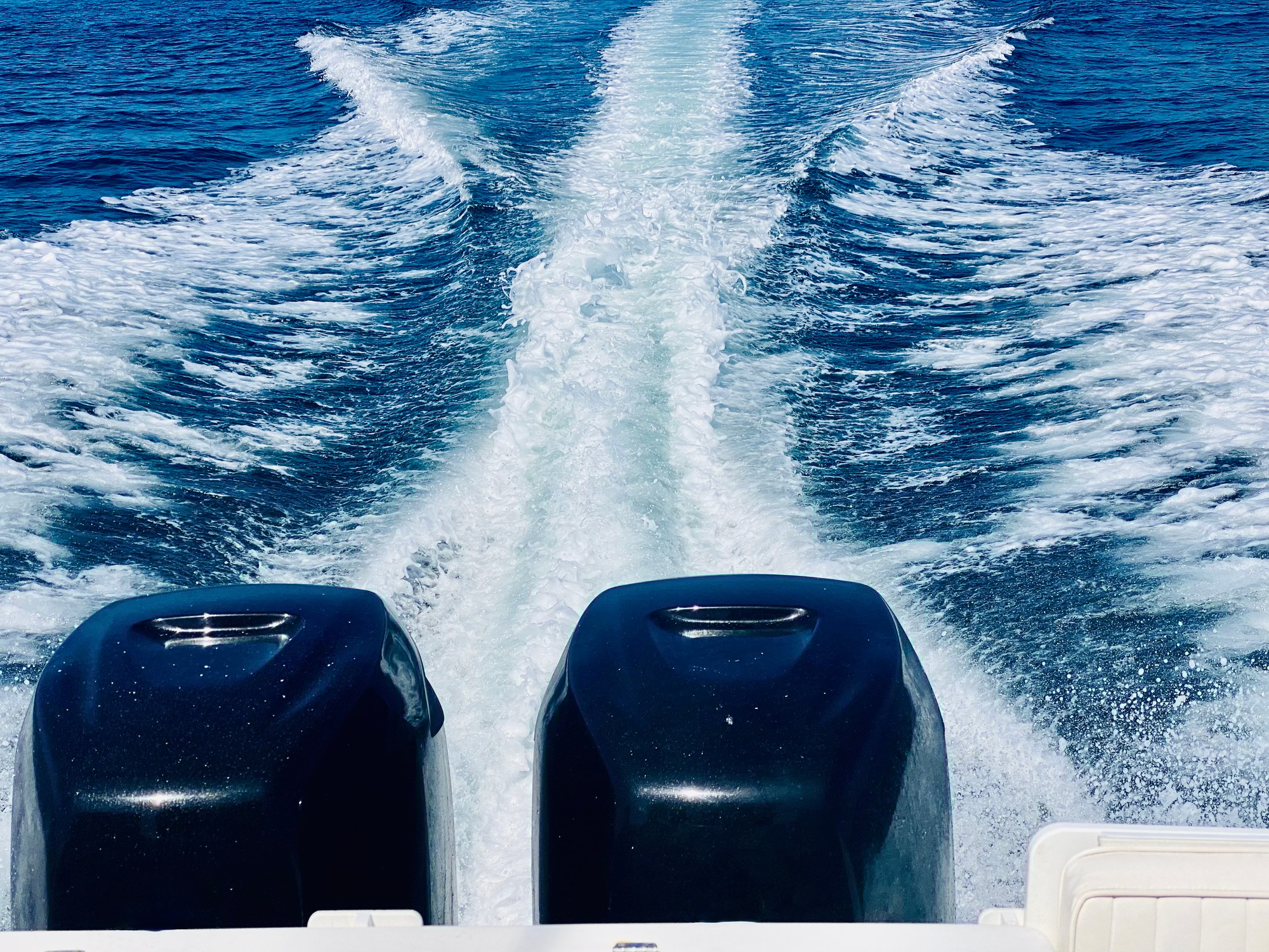 The wake of a speed boat yacht in the open Pacific